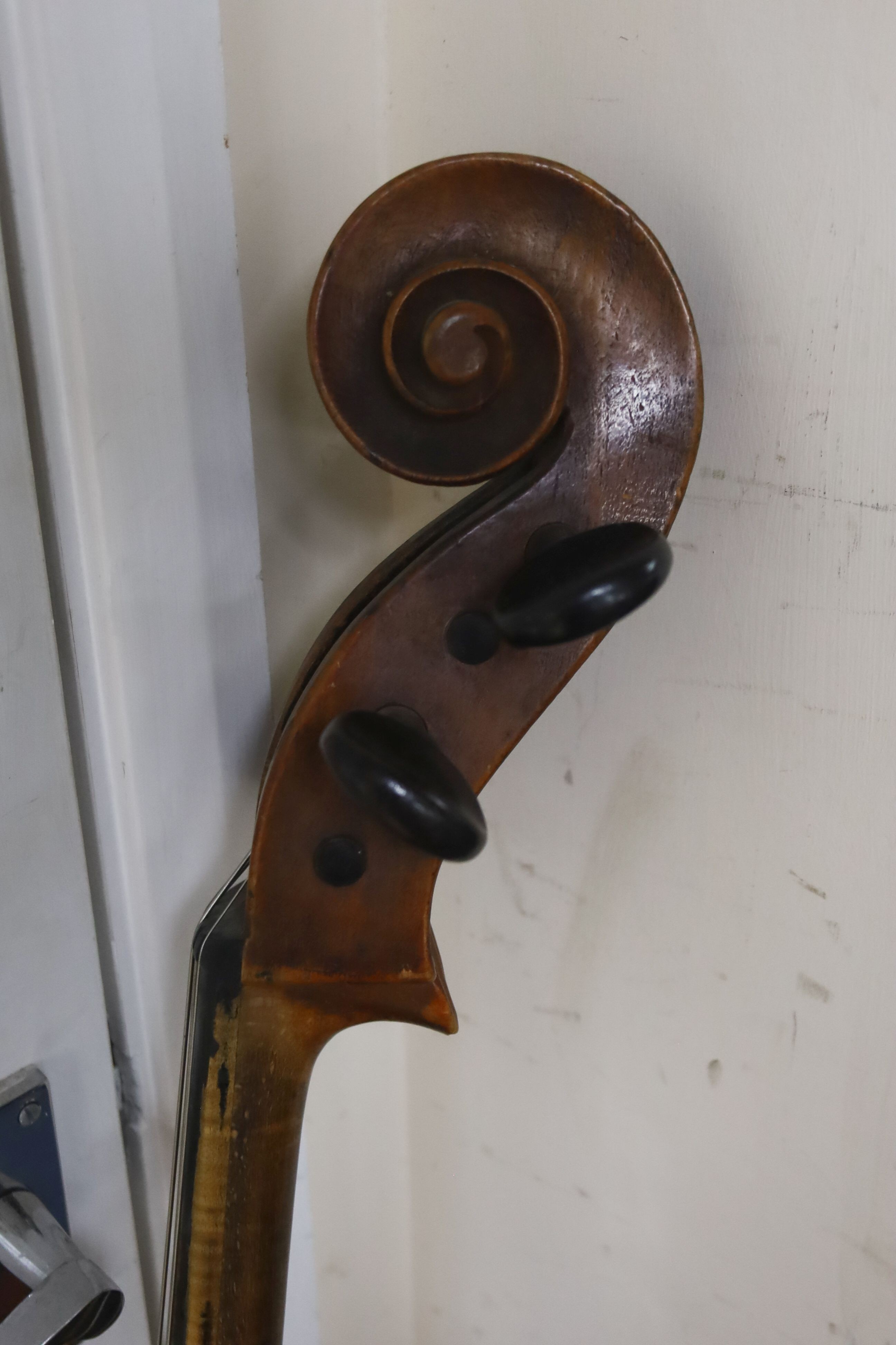 Early 20th century German cello and bow, the back measuring 75cm excluding the button